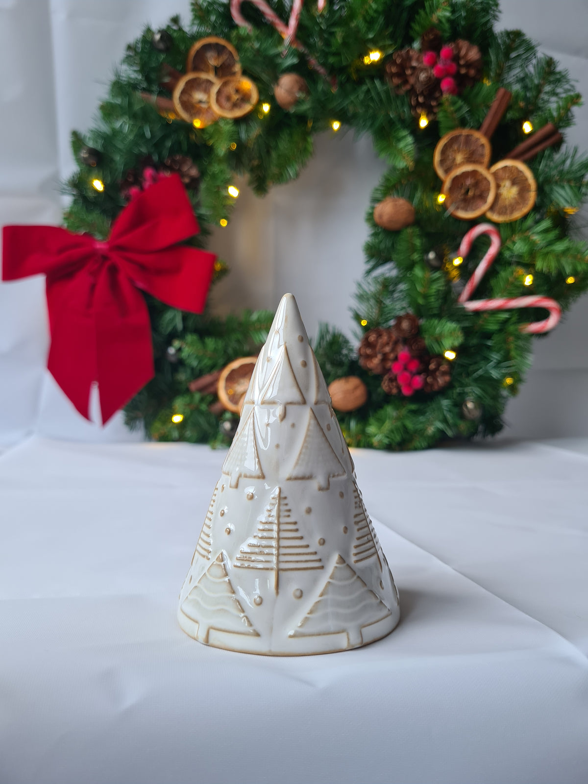 White Reactive Glaze Ceramic Christmas Tree Ornament adorned with hand finished Embossed Festive Trees
