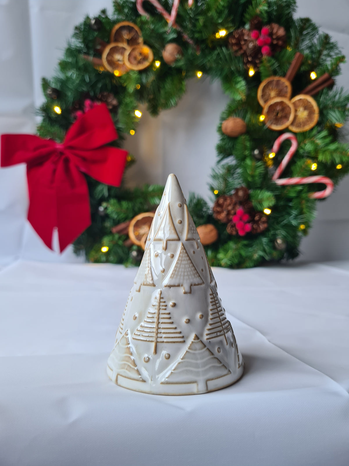 White Reactive Glaze Ceramic Christmas Tree Ornament adorned with hand finished Embossed Festive Trees