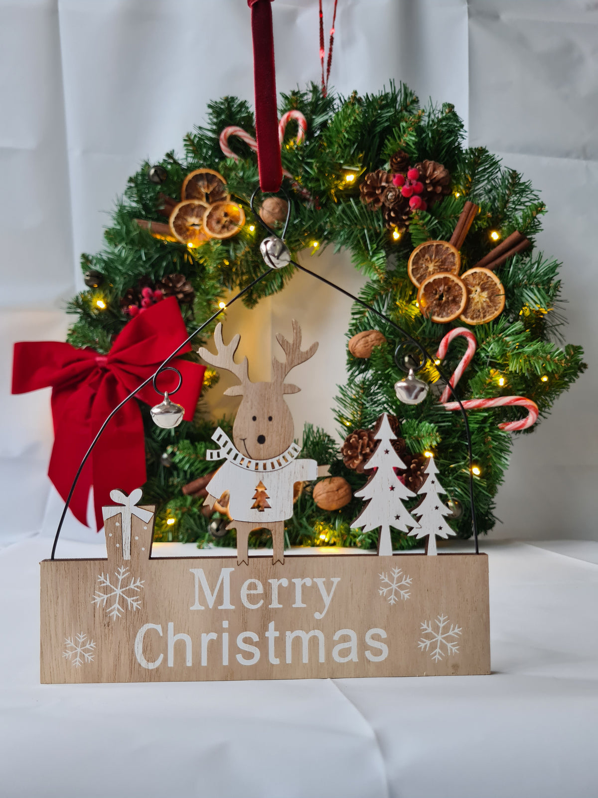 Rustic Wooden Reindeer "Merry Christmas" Hanging Sign with Red Velvet Ribbon and jingle bells